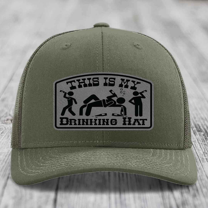 Olive green trucker hat with a black and grey &