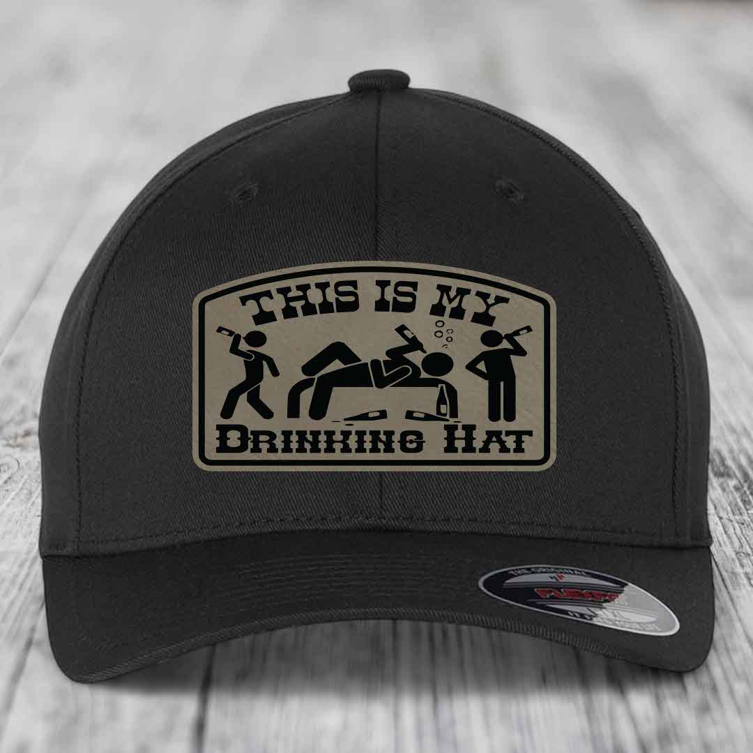 Black baseball cap with beige patch reading &