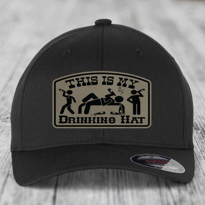 Black baseball cap with beige patch reading &