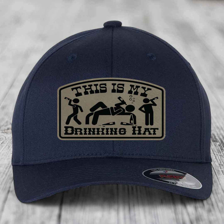Dark blue baseball cap with a beige patch that reads &