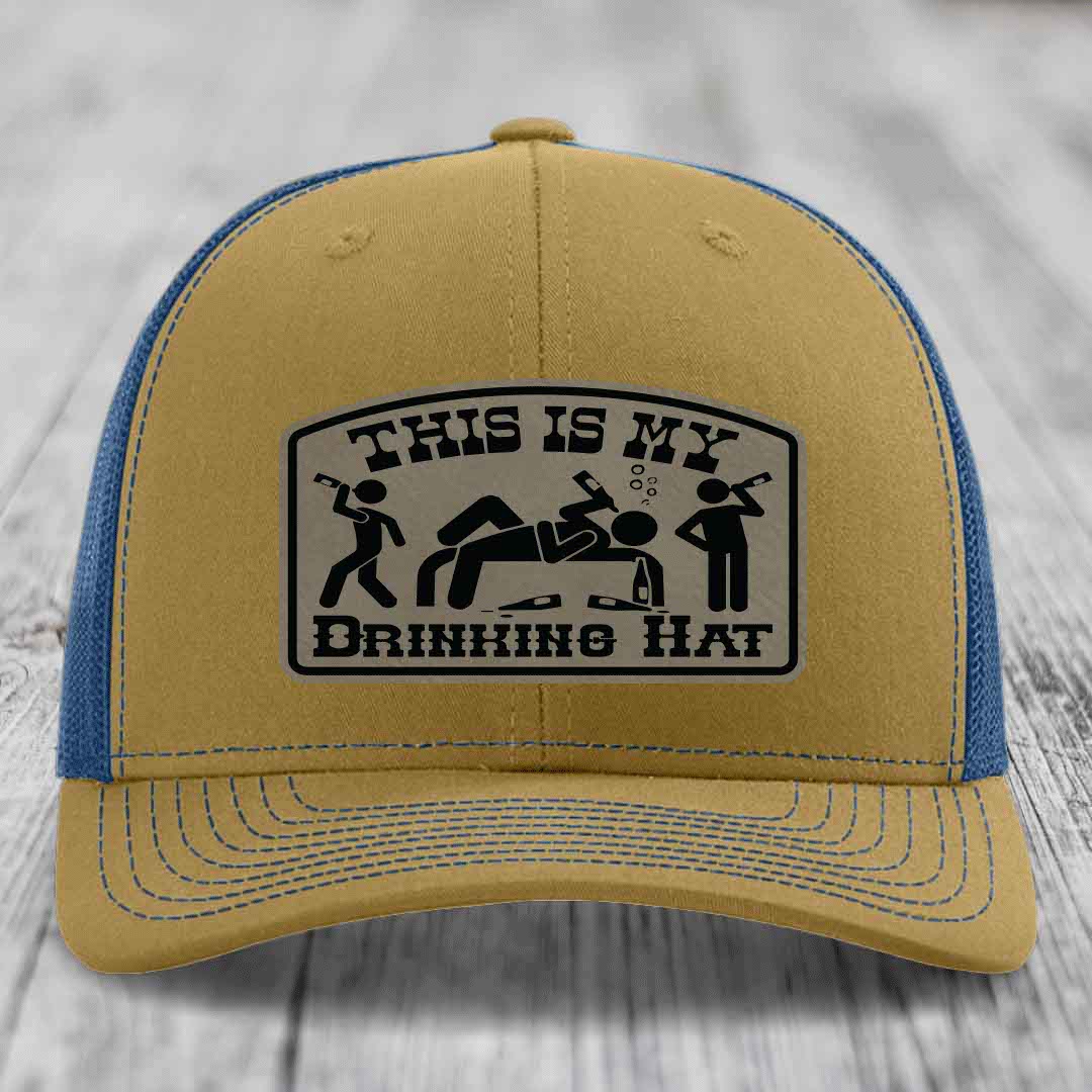 Tan and blue trucker hat with &