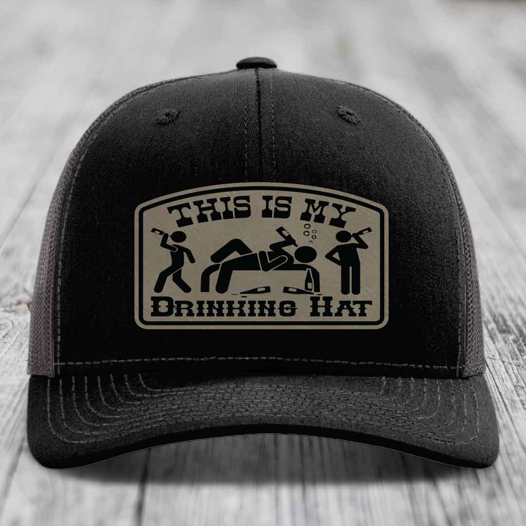 Black trucker hat with beige patch reading &