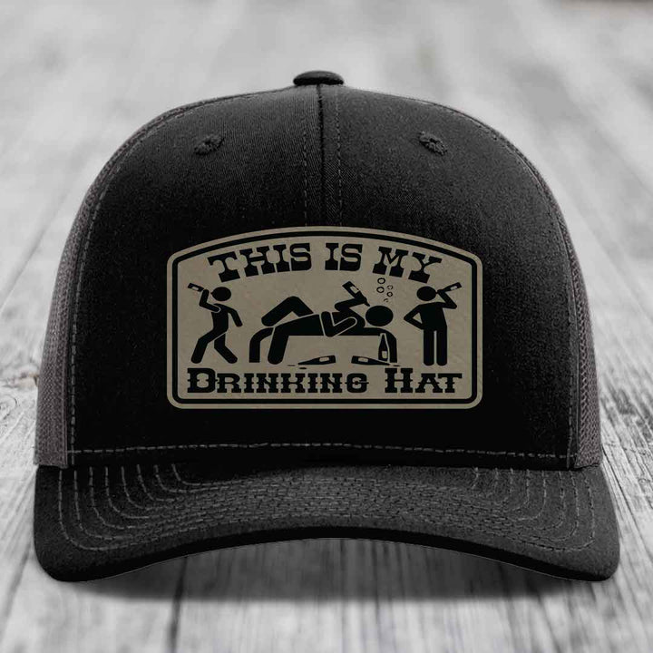 Black trucker hat with beige patch reading &