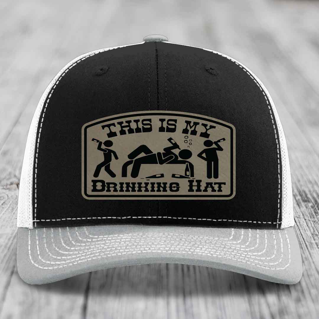 Black trucker hat with beige patch reading &