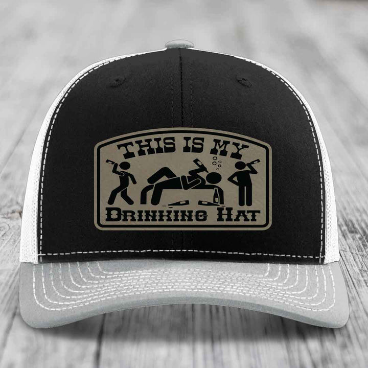 Black trucker hat with beige patch reading &
