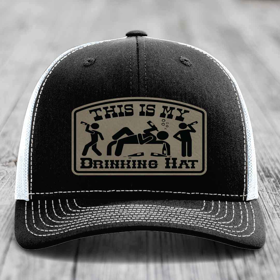 Black trucker hat with beige patch reading &