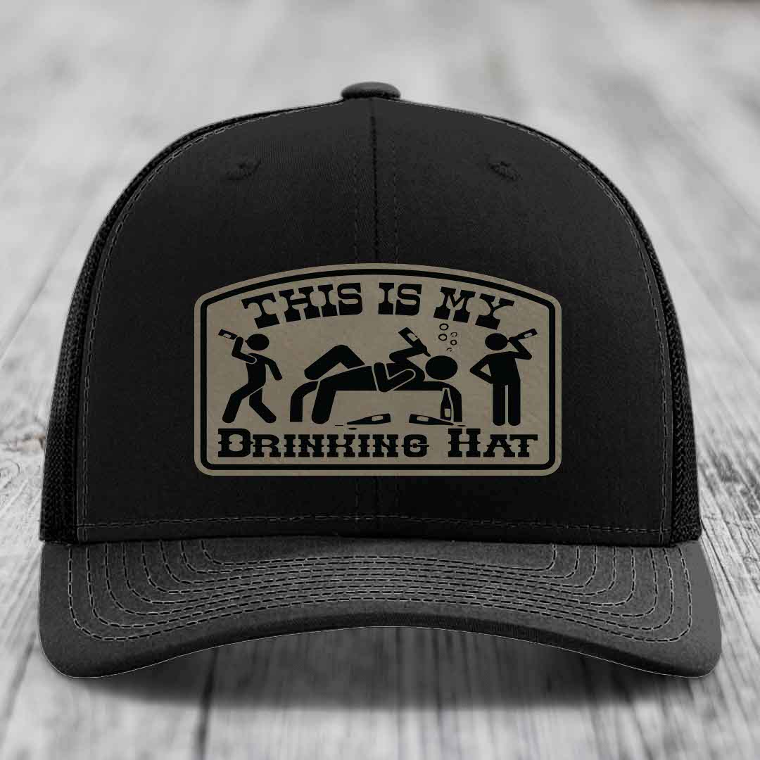Black trucker hat with beige patch reading &