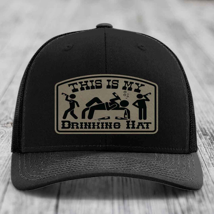 Black trucker hat with beige patch reading &