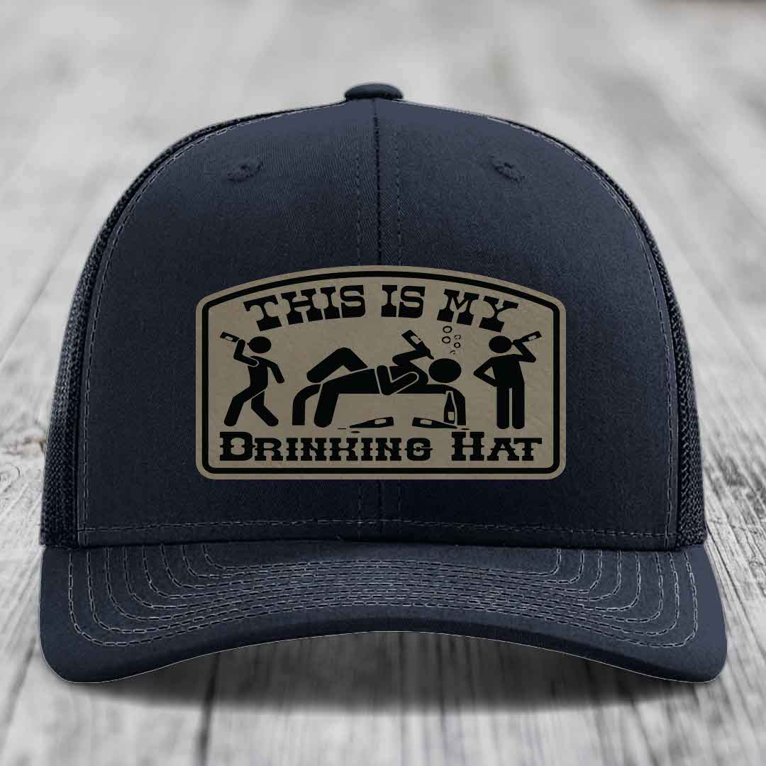 Black trucker hat with beige patch reading &