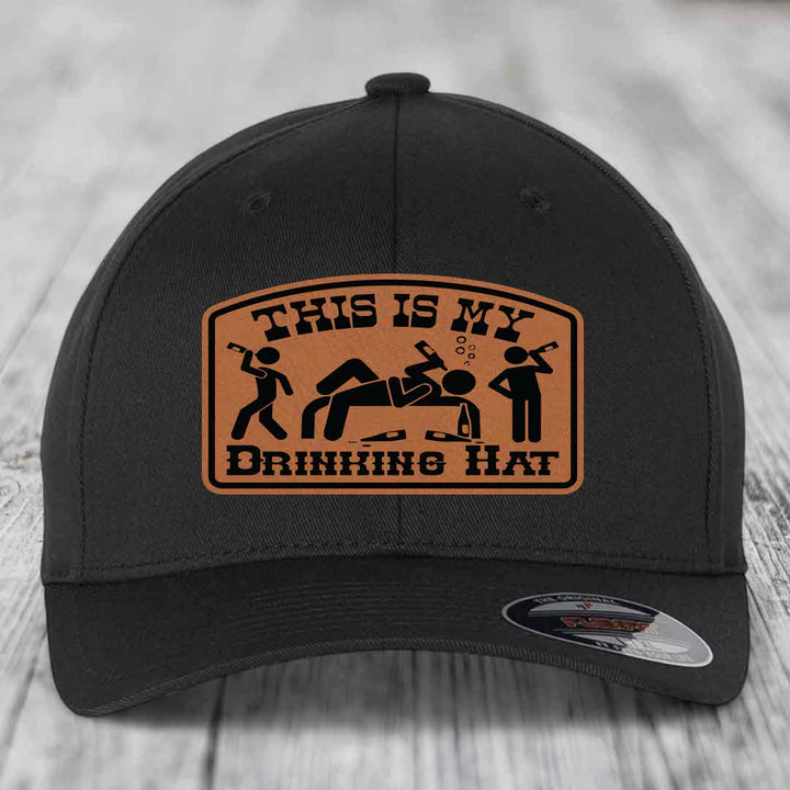 Black baseball cap with brown leather patch reading &