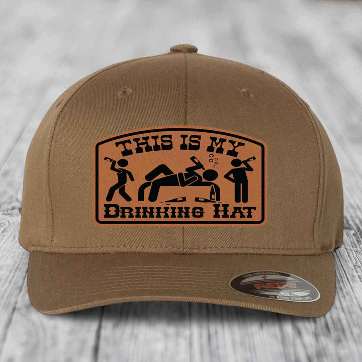 Tan baseball cap with brown leather patch reading &