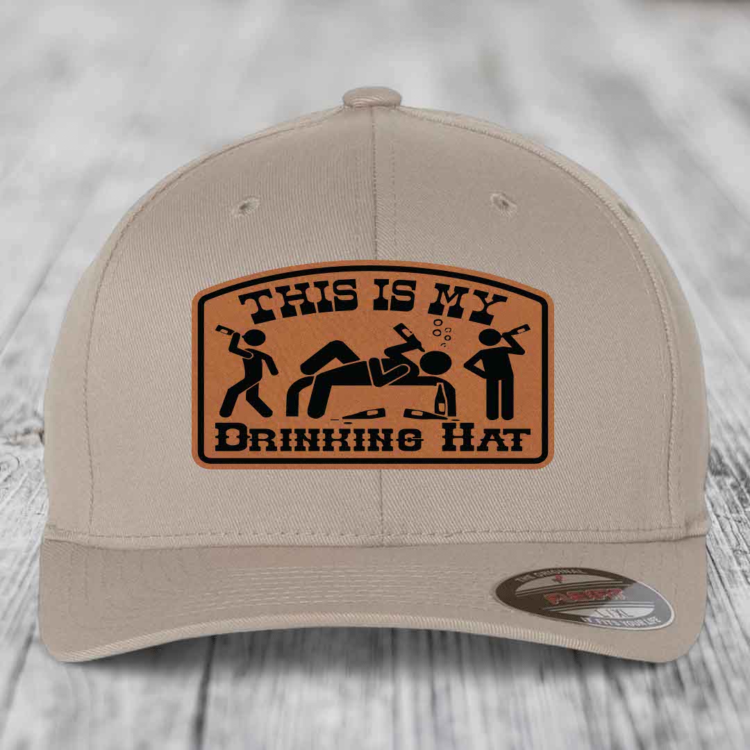 Beige baseball cap with brown leatherette patch reading &
