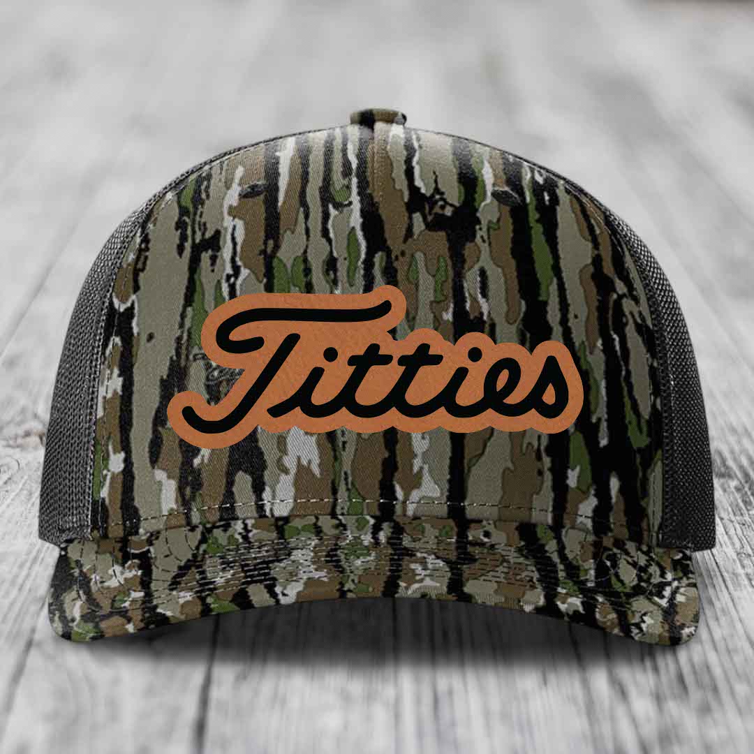Camouflage trucker hat with brown leatherette patch reading &