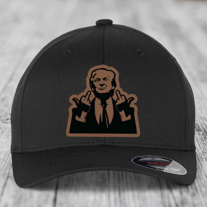 Black baseball cap with brown and black graphic patch of a man making hand gestures.