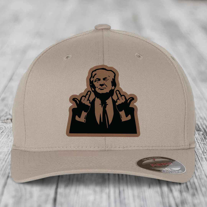 Beige baseball cap with a black and brown leatherette patch of a man making hand gestures.