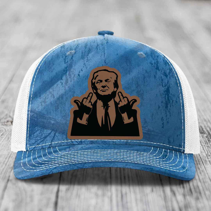 Blue and white trucker hat with a brown leather patch of a man making rude hand gestures.