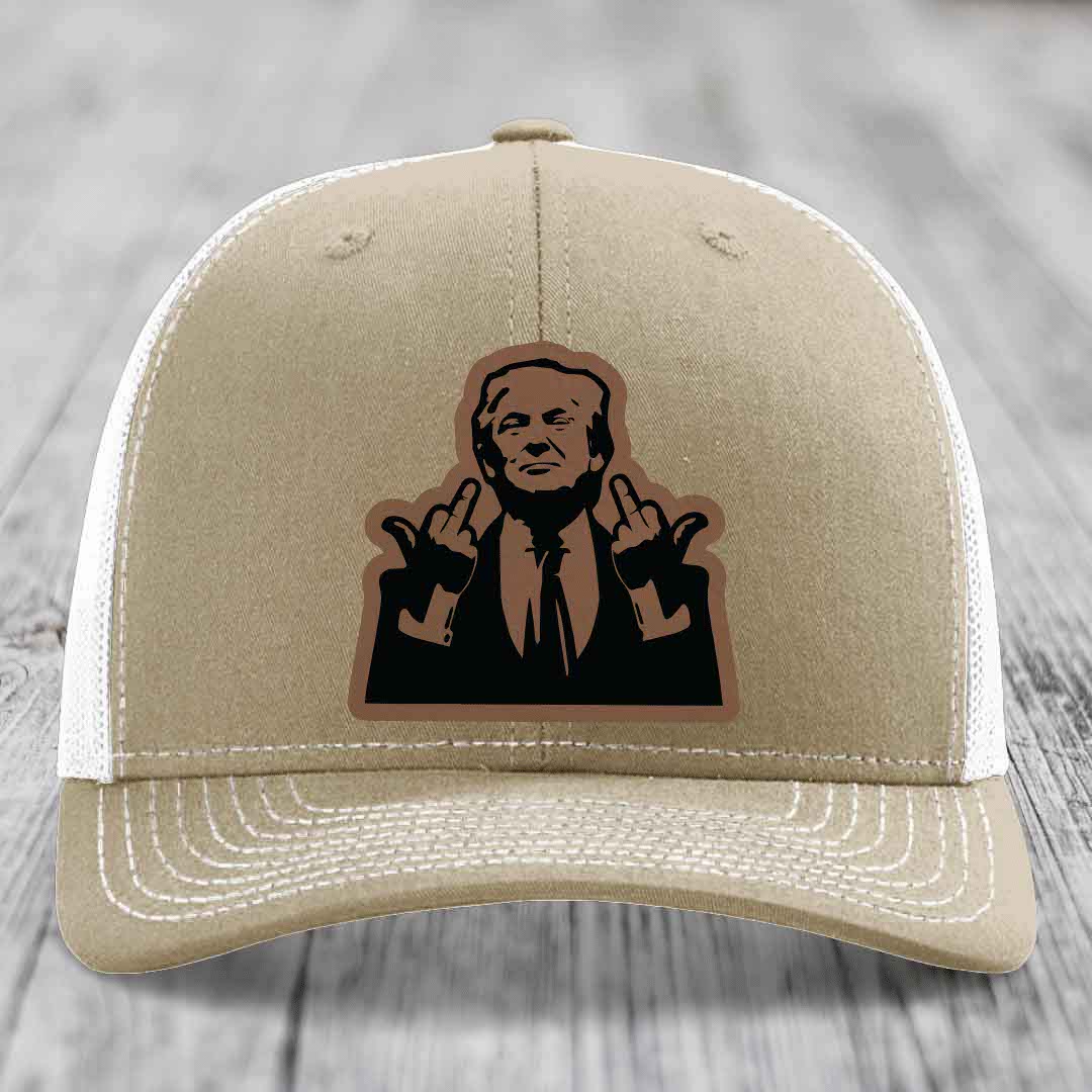 Tan trucker hat with white mesh back and embroidered patch of man making hand gestures.