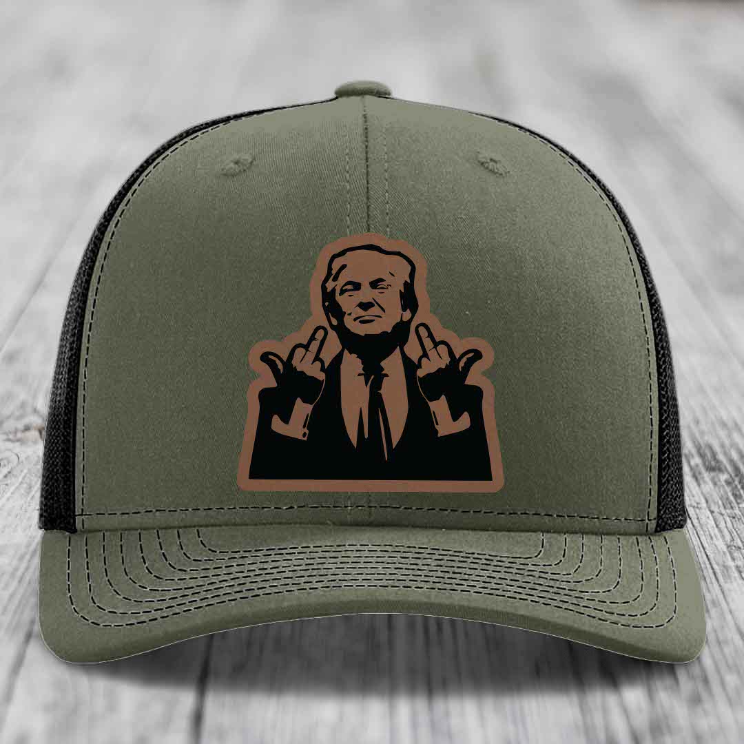 Olive green trucker hat with black mesh back and a brown leatherette patch of a man making rude hand gestures.