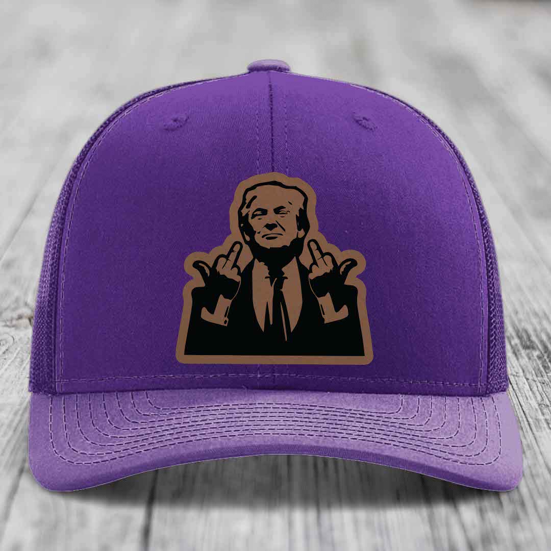 Purple trucker hat with a brown and black graphic patch of a man making hand gestures.