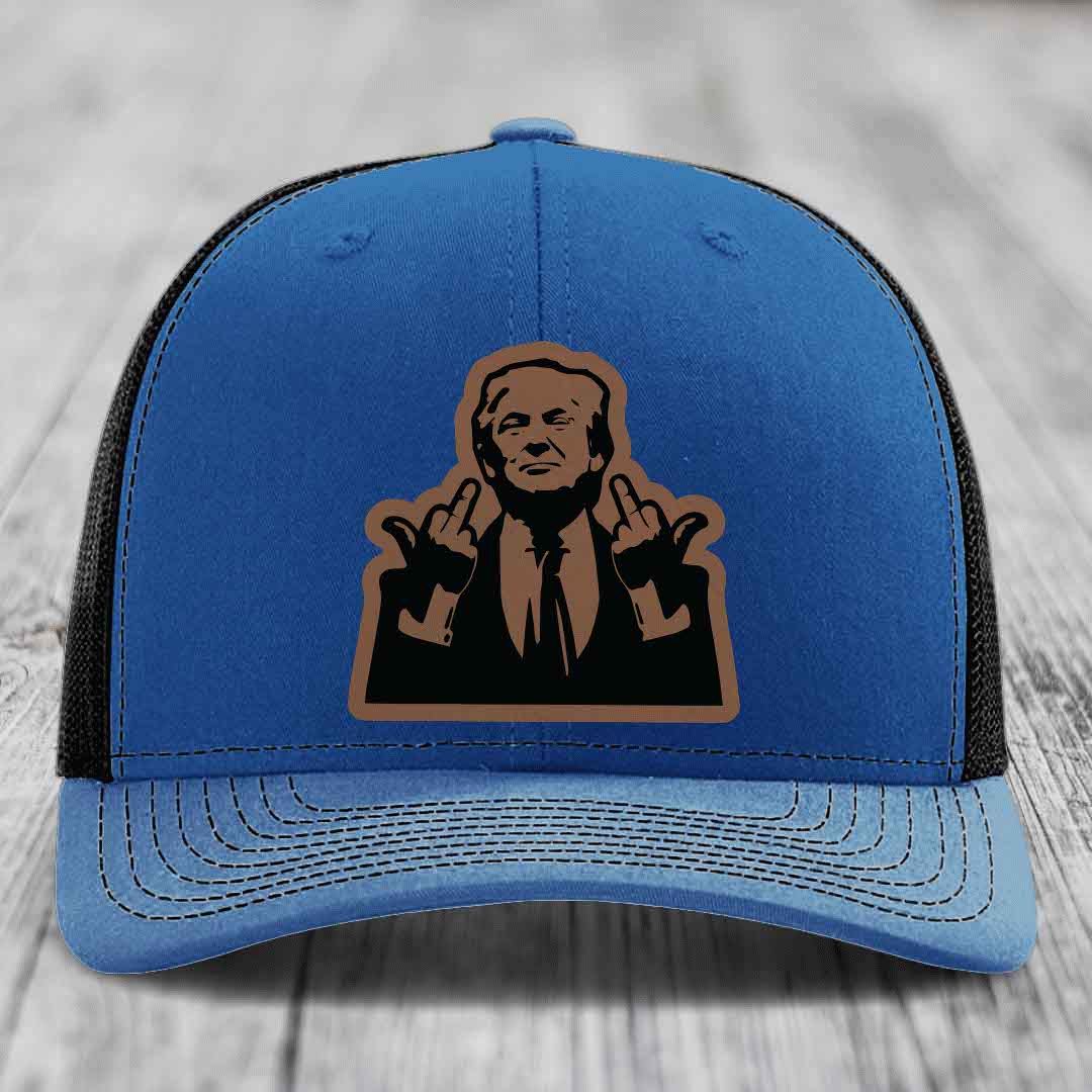 Blue trucker hat with black mesh back and brown leather patch of a man giving two middle fingers.