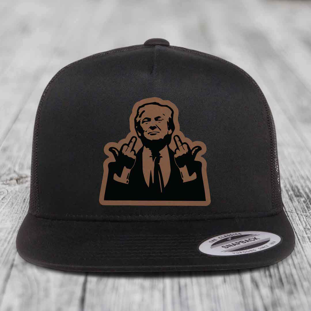 Black snapback hat with brown and black graphic patch of a man making hand gestures.