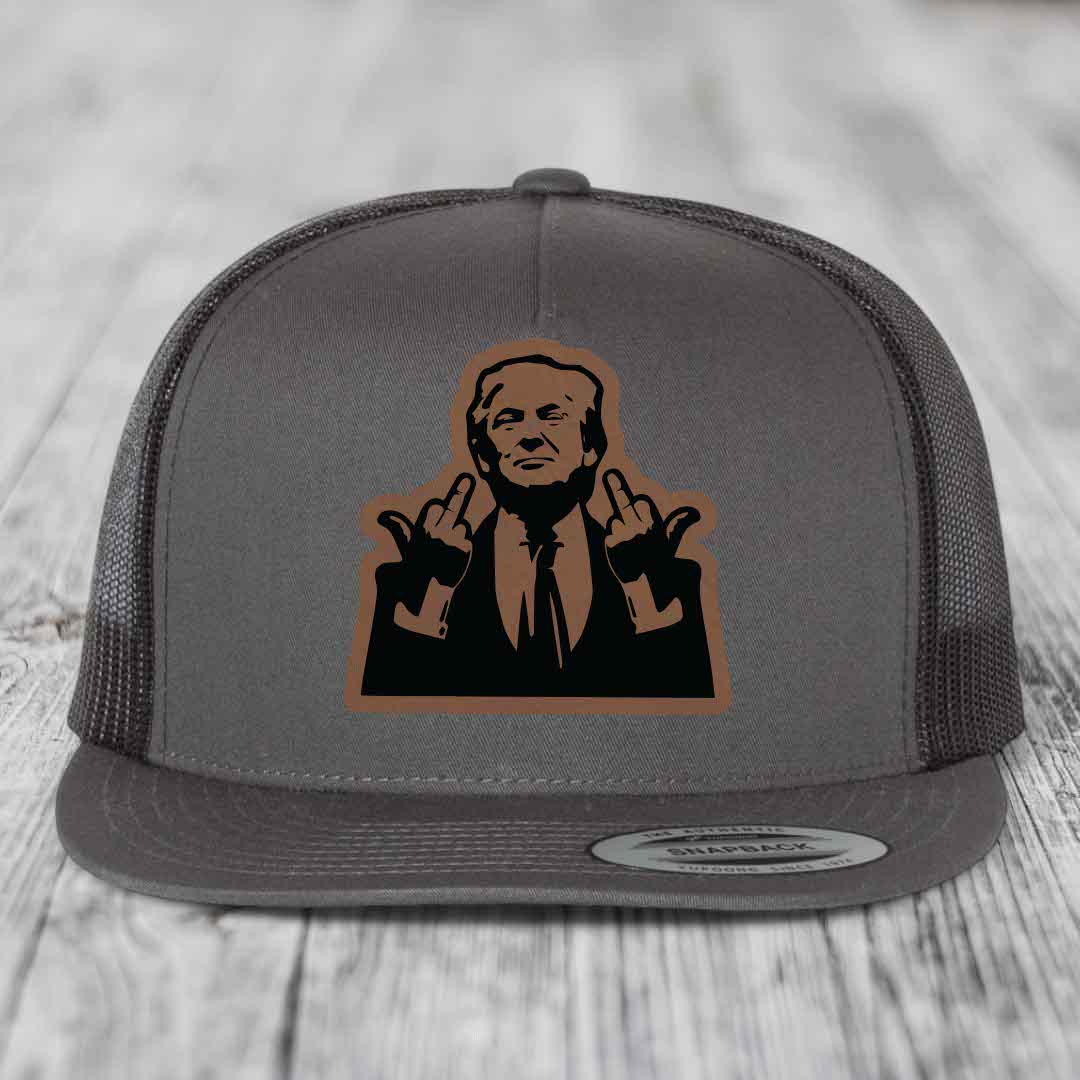 Grey trucker hat with brown leather patch of man making rude hand gesture.