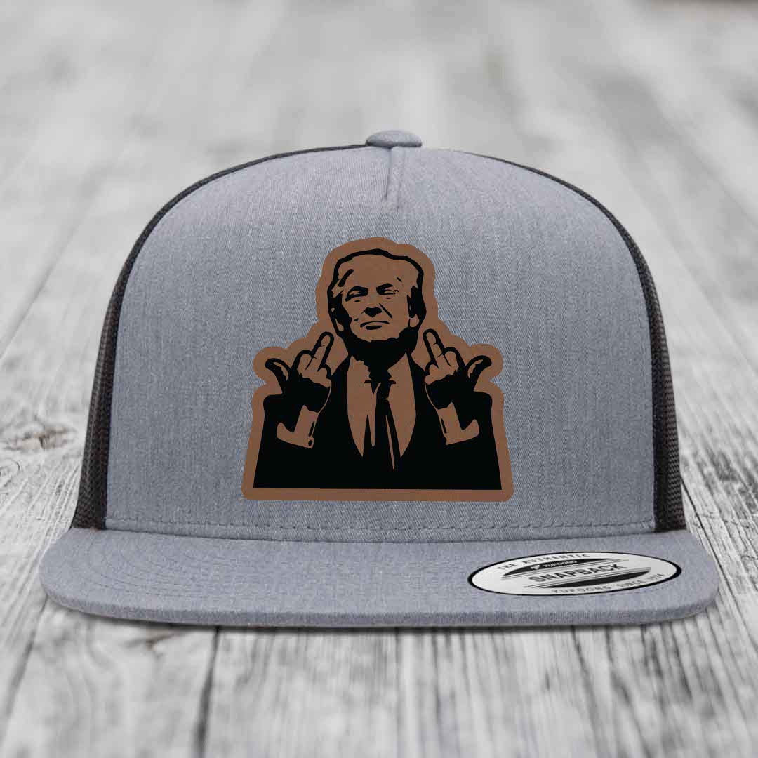Grey trucker hat with black and brown leather patch of man making rude hand gestures.