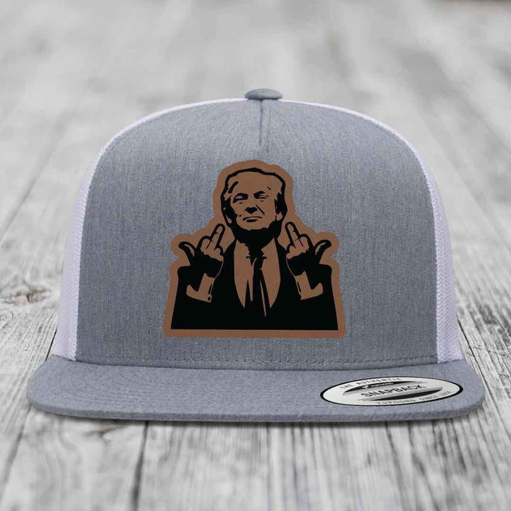 Grey trucker hat with brown and black patch of man making rude hand gesture.