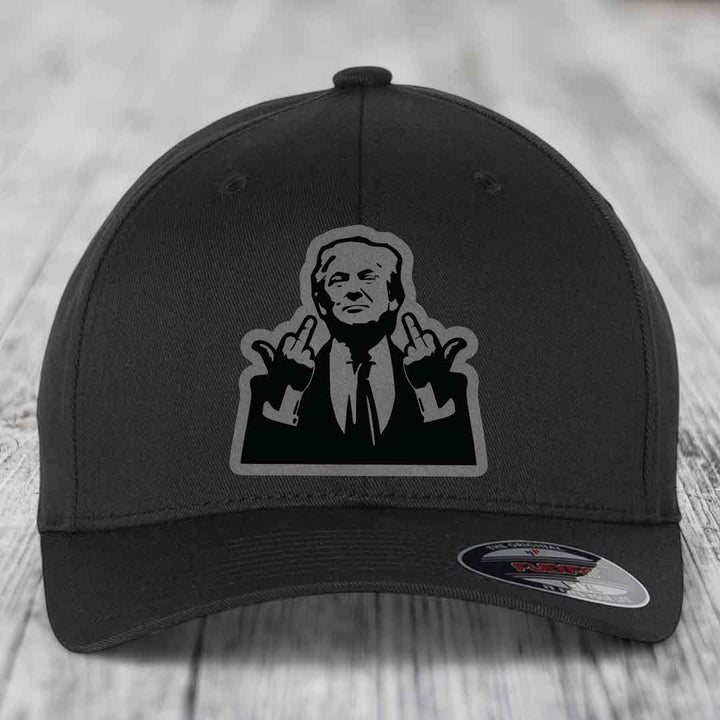 Black baseball cap with a graphic patch of a man making hand gestures.