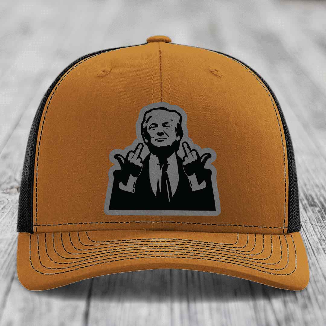 Tan trucker hat with black mesh back and gray patch of man making hand gestures