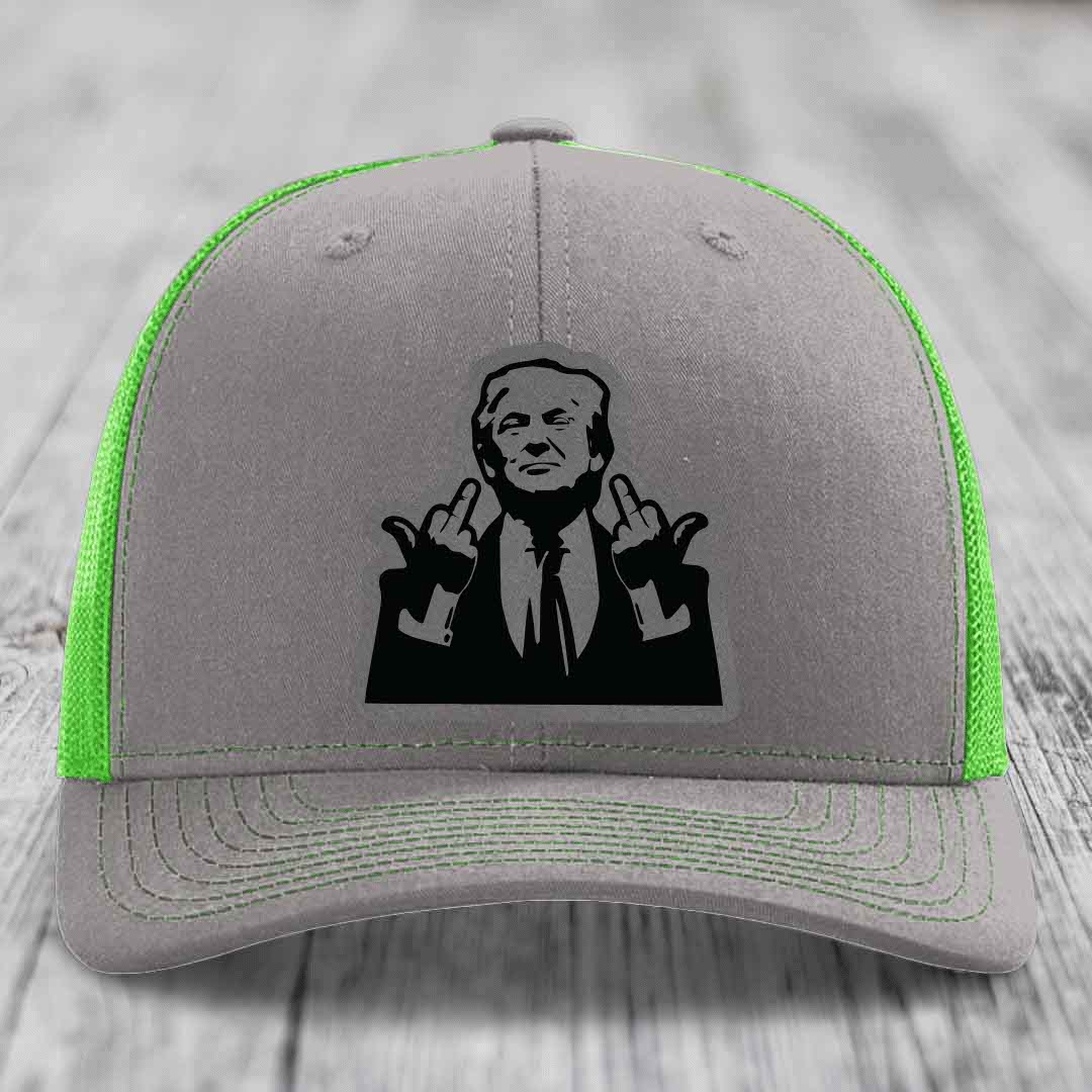 Grey trucker hat with neon green mesh and stitching, featuring a black patch of a man making rude hand gestures.