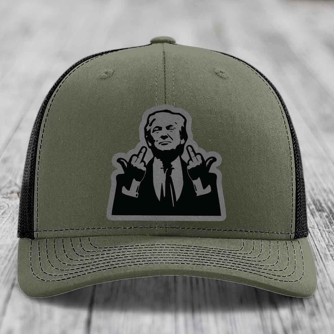 Olive green trucker hat with black mesh back and a black-and-white graphic patch of a man making hand gestures.