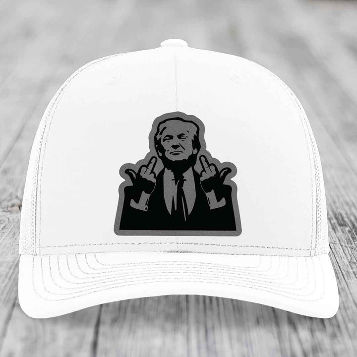 White trucker hat with black and grey patch of man making rude hand gesture