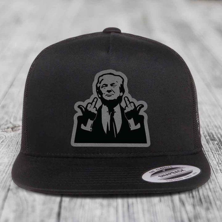 Black snapback hat with a graphic patch of a man making hand gestures.