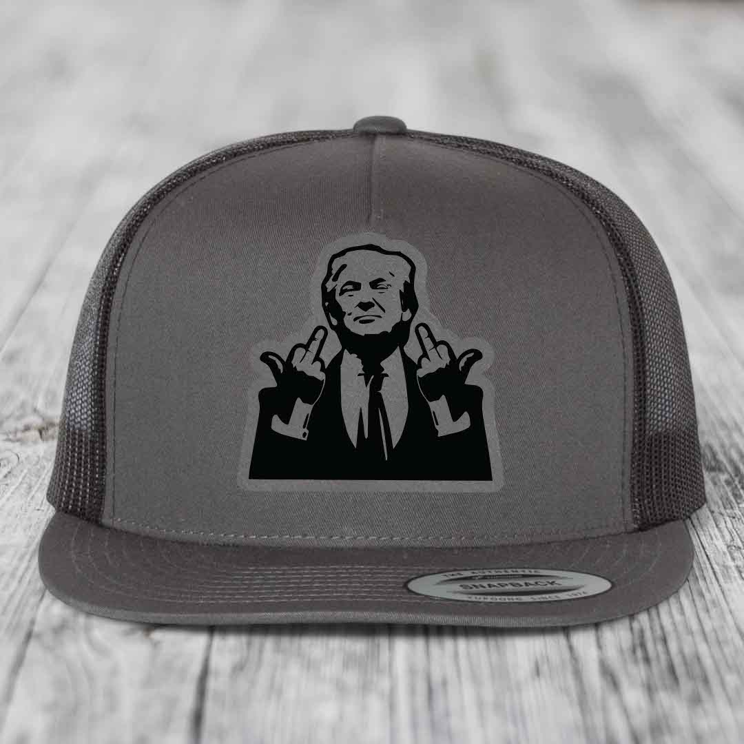 Grey trucker hat with black silhouette patch of a man making hand gestures.