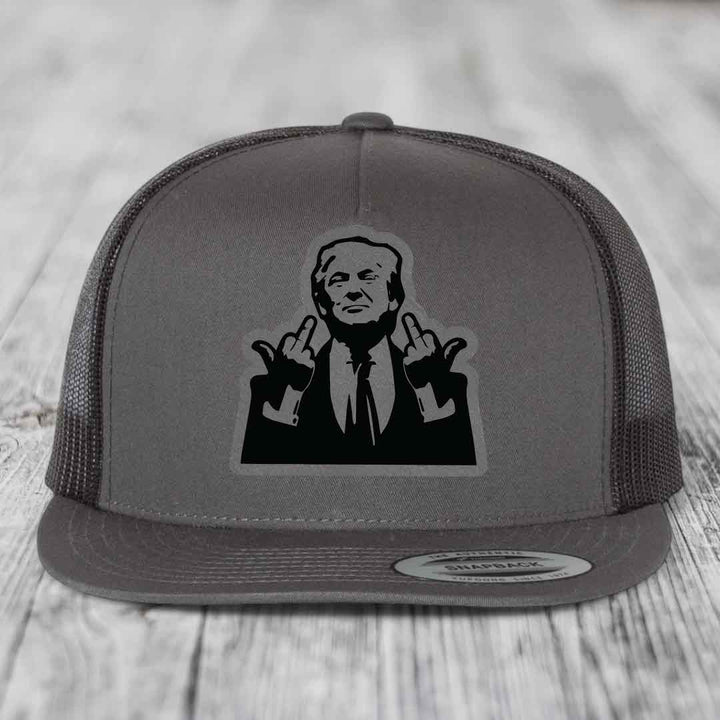 Grey trucker hat with black silhouette patch of a man making hand gestures.