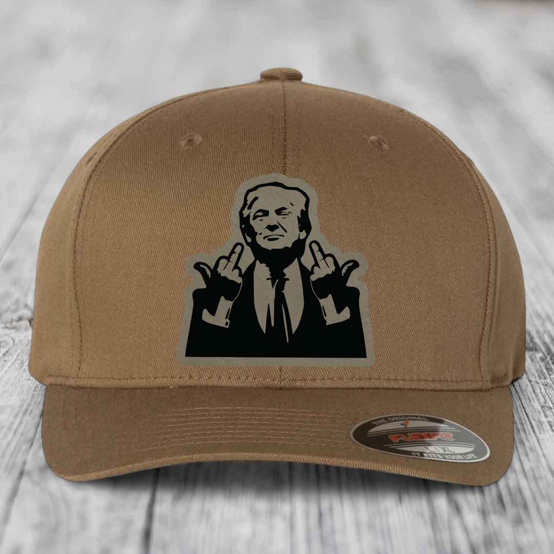 Tan baseball cap with black and grey graphic patch of a man making hand gestures.