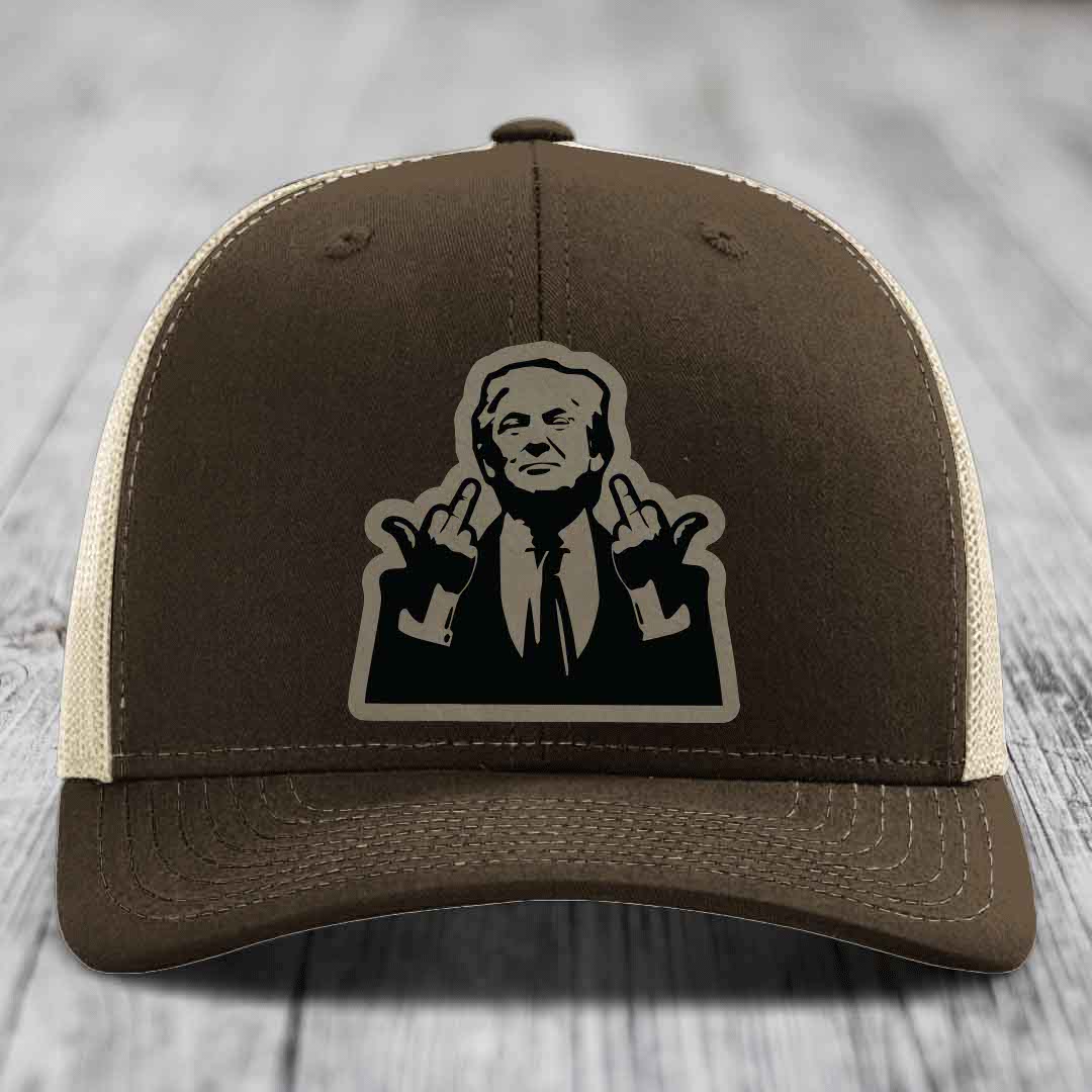 Brown trucker hat with beige mesh back and black silhouette patch of a man giving middle fingers.