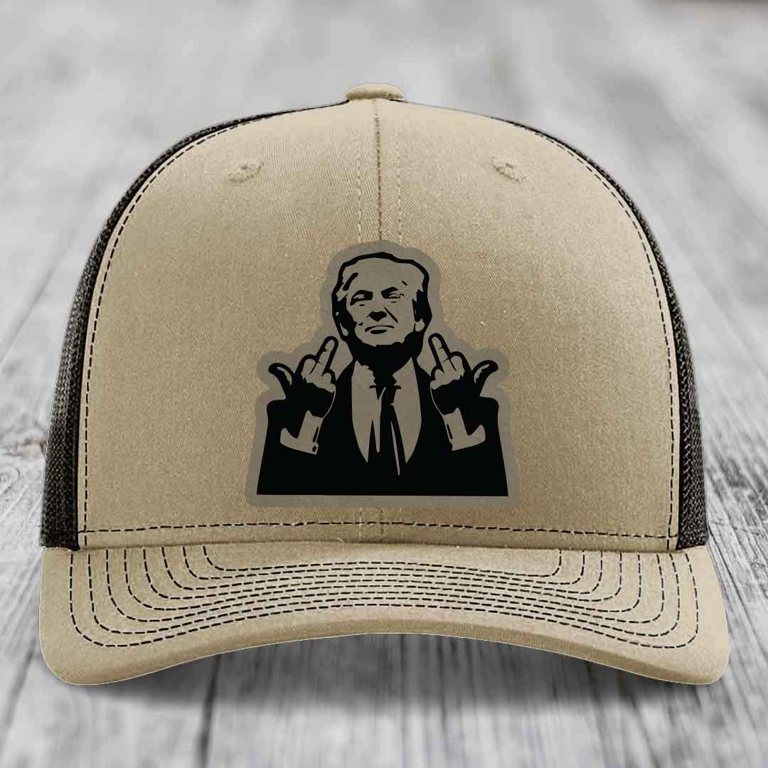 Beige trucker hat with black mesh back and a black silhouette patch of a man making rude hand gestures.