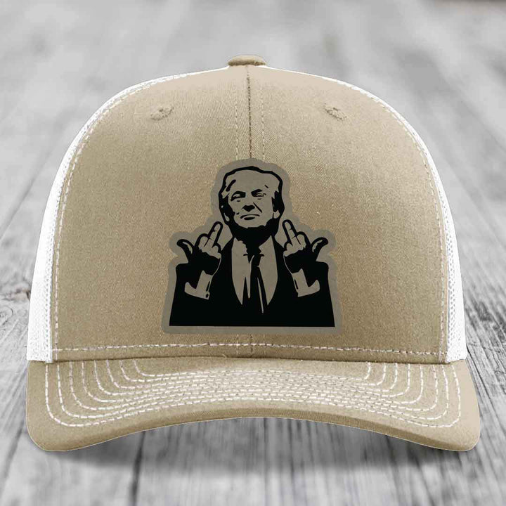 Tan trucker hat with black silhouette patch of a man making rude hand gestures.