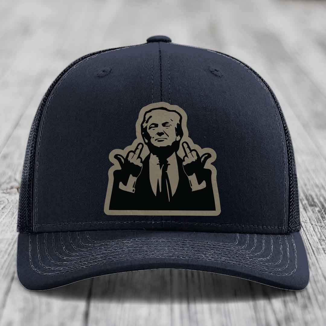 Black trucker hat with beige and black patch of man making two middle fingers gestures.