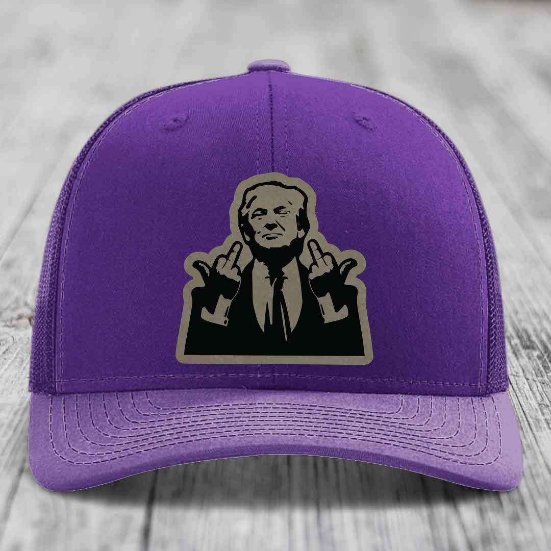 Purple trucker hat with a graphic patch of a man making rude hand gestures.