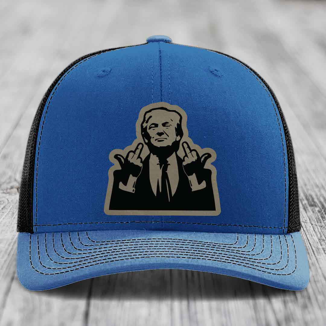 Blue trucker hat with black mesh back and a beige leather patch of a man making hand gestures.