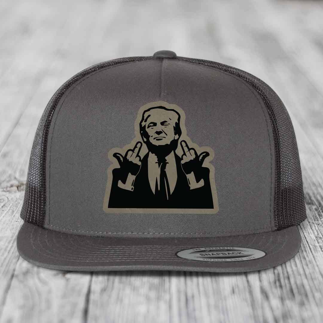 Grey trucker hat with black and tan patch of man making rude hand gesture