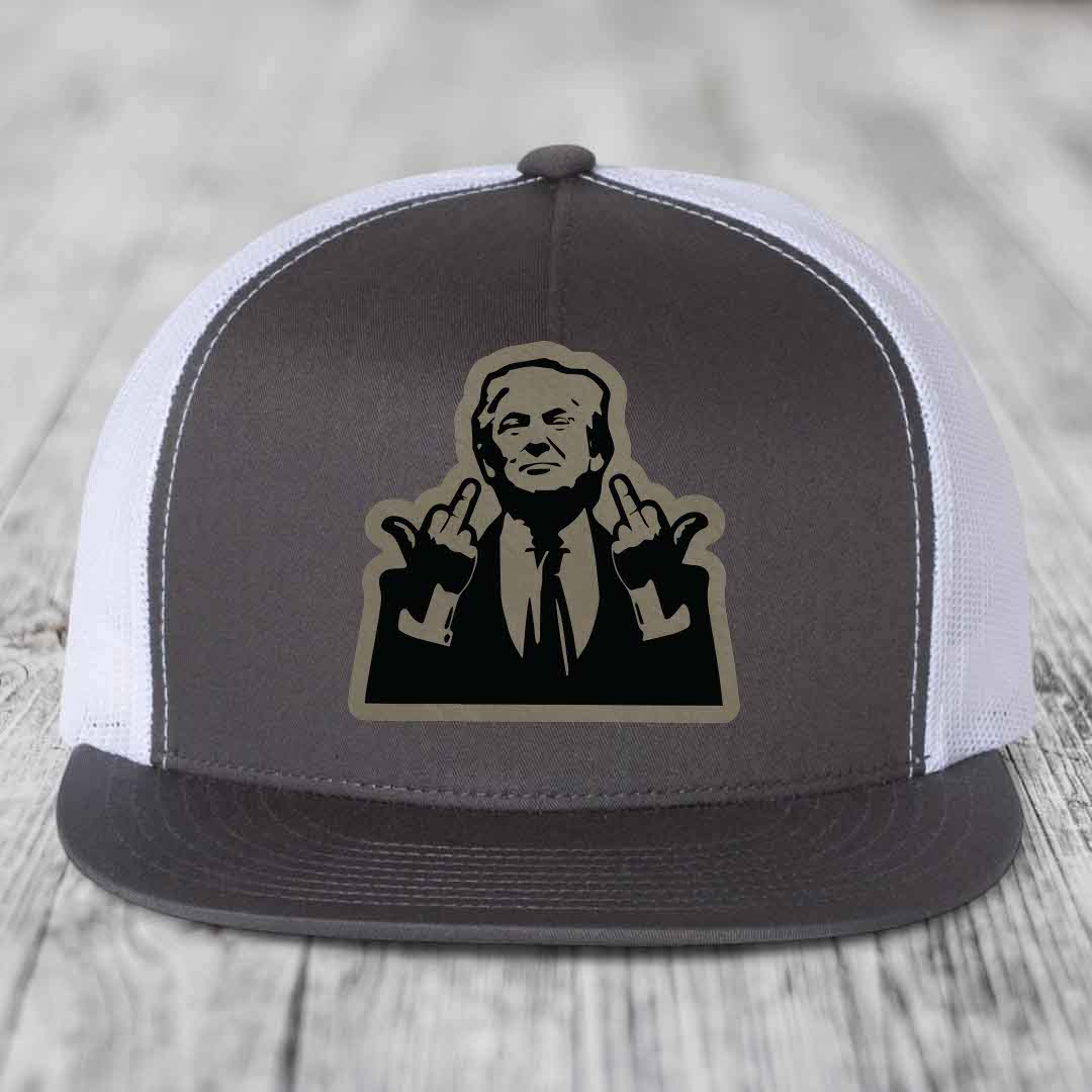 Grey and white trucker hat with a black and tan graphic patch of a man making hand gestures.