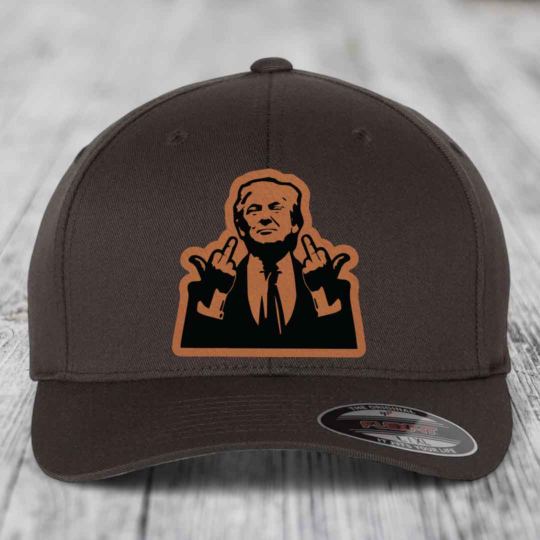 Dark brown Flexfit hat with a tan leatherette patch of a man making rude hand gestures.