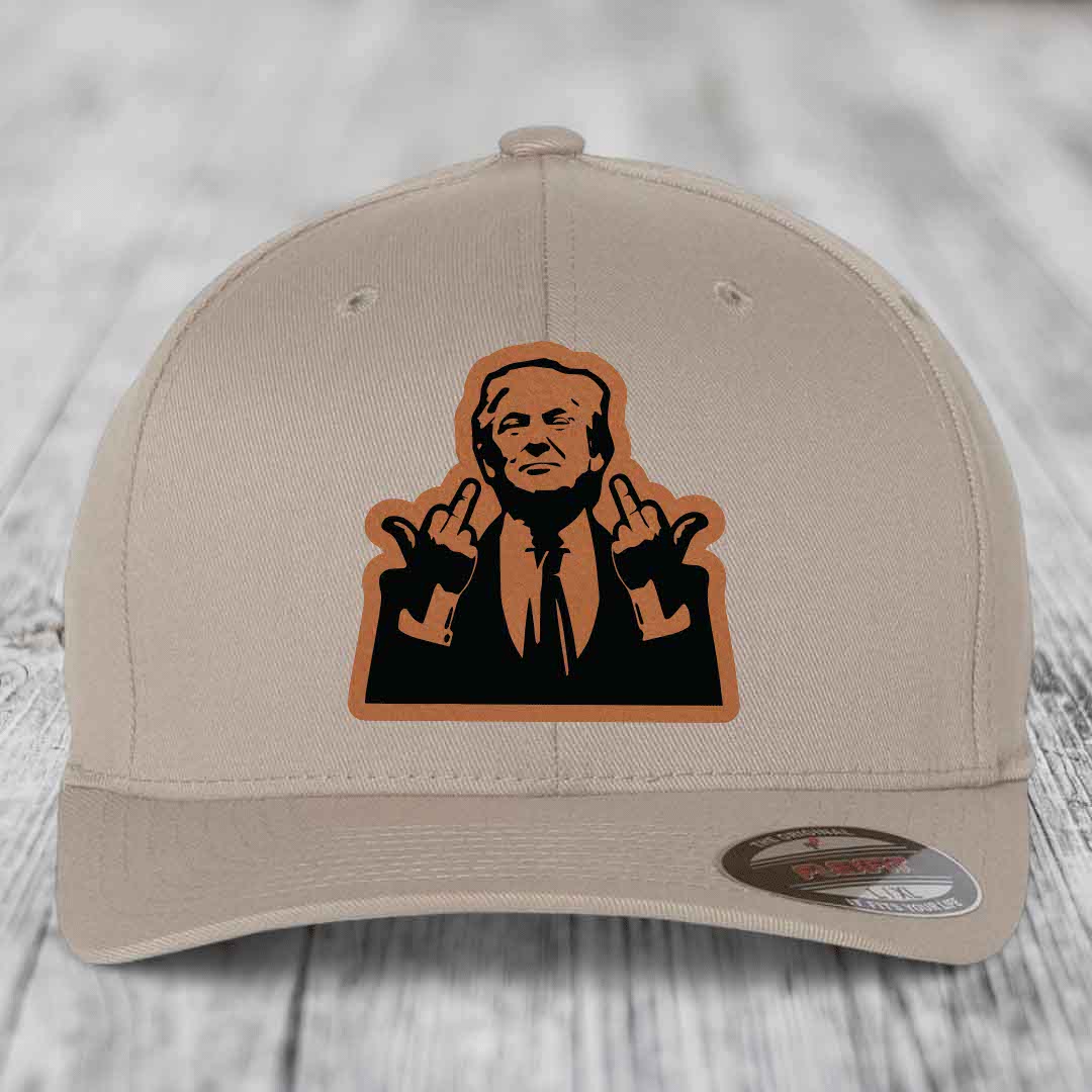 Beige baseball cap with a brown leather patch featuring a silhouette of a man making hand gestures.
