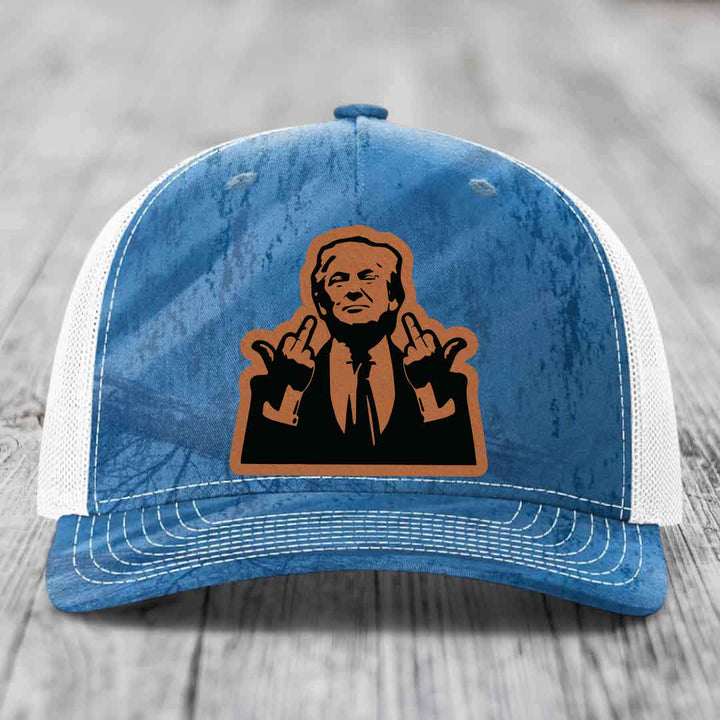 Blue and white trucker hat with a brown leather patch of a man making rude hand gestures.