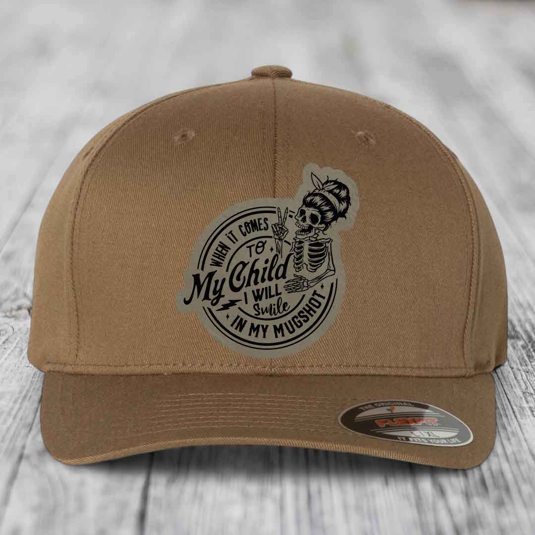 When It Comes To My Child, I Will Smile In My Mugshot (Mama) - Leather Patch Hat - Light Brown to Black Patch - Flexfit 6277 Fitted Hat