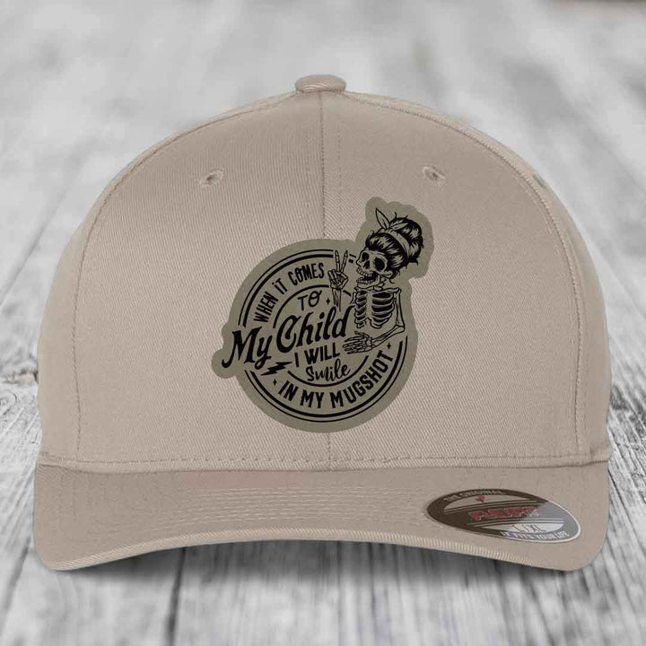 When It Comes To My Child, I Will Smile In My Mugshot (Mama) - Leather Patch Hat - Light Brown to Black Patch - Flexfit 6277 Fitted Hat